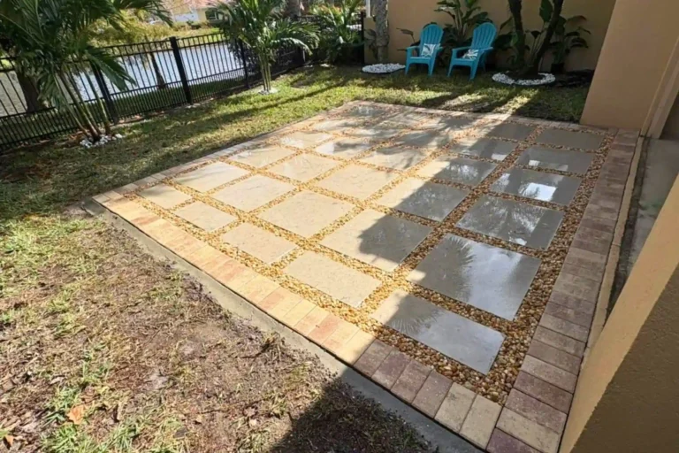 Contemporary patio design with large square concrete pavers and decorative gravel joints in Orlando, Florida — Rock Pavers.
